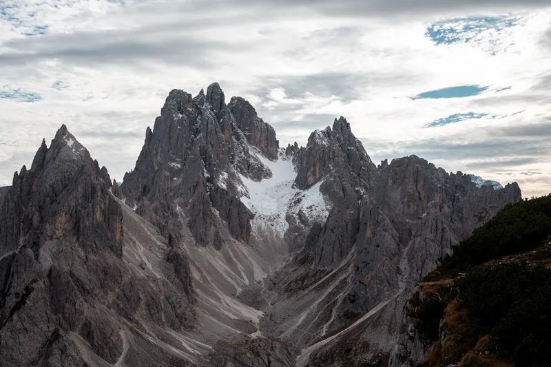 Jagged mountain peaks under a cloudy sky